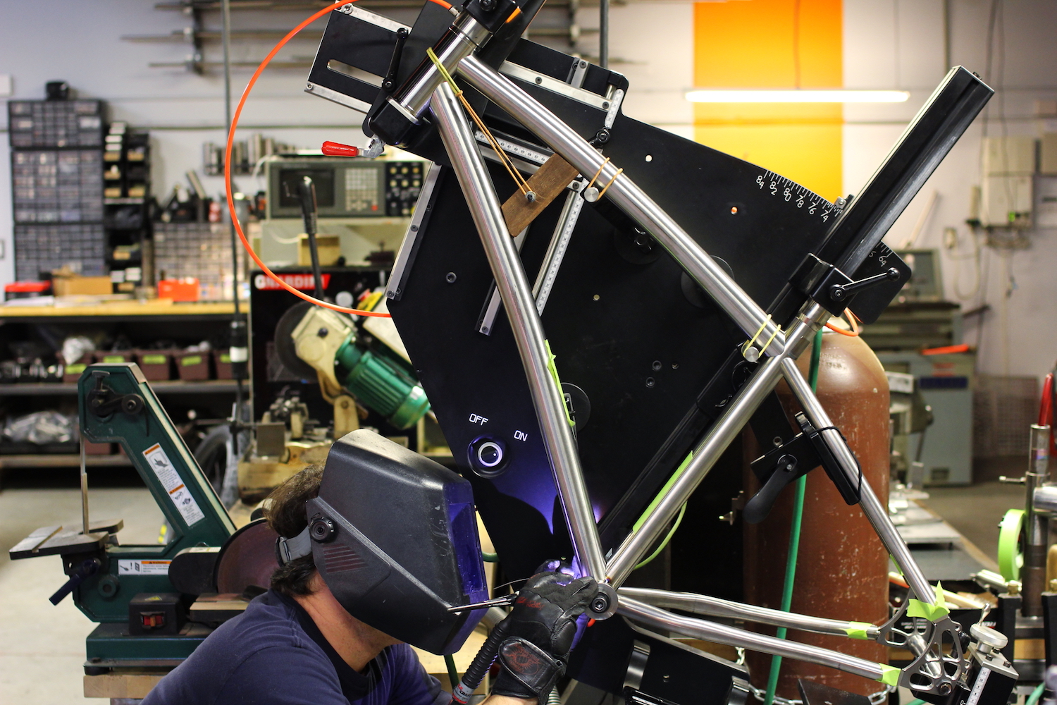 Jamie carefully tack-welding the frame together.