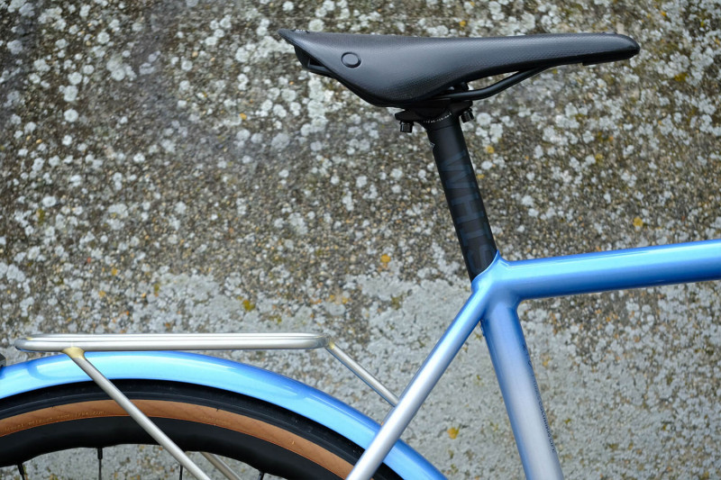 Closeup of a Whisky seatpost installed on a Victore Cycles blue randonneur bike.